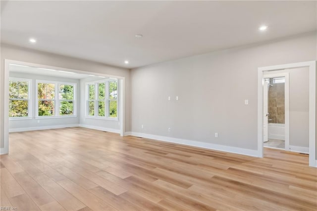 empty room with light hardwood / wood-style floors