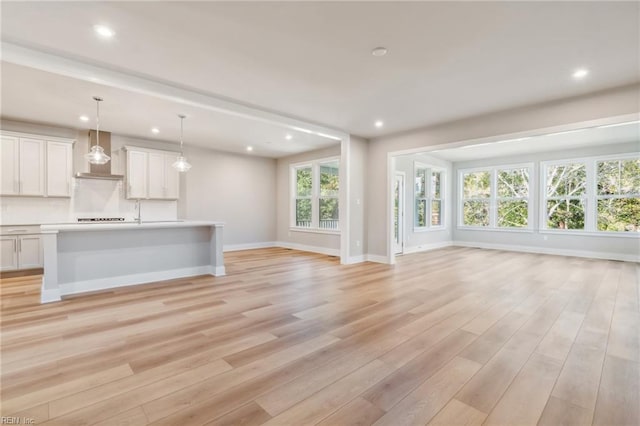 unfurnished living room with light hardwood / wood-style floors