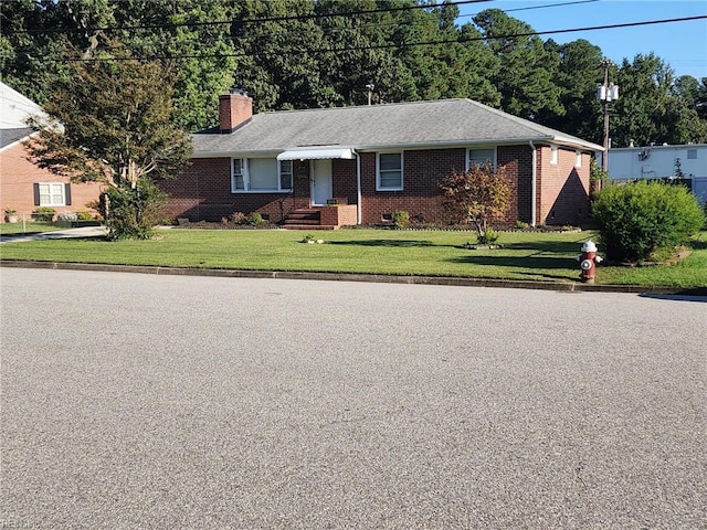 ranch-style house with a front yard