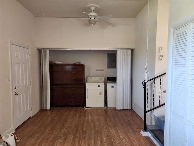 hallway featuring electric panel, separate washer and dryer, and dark wood-type flooring