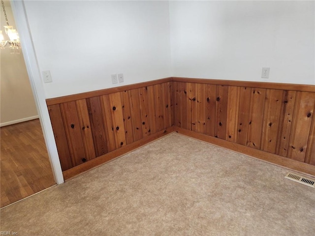 empty room featuring light colored carpet