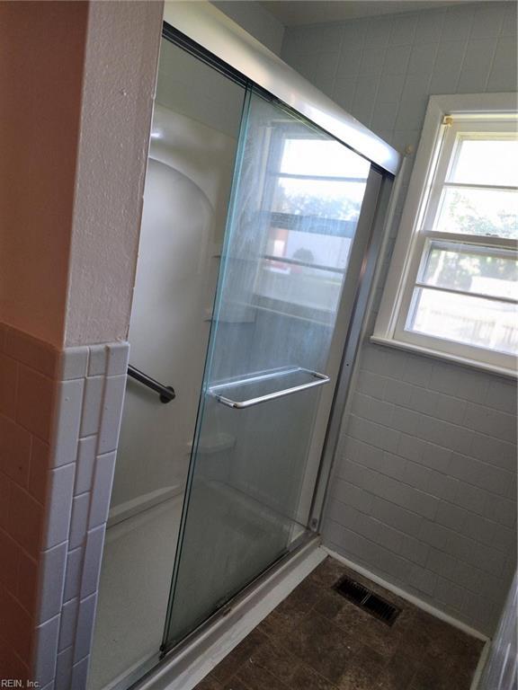 bathroom with an enclosed shower