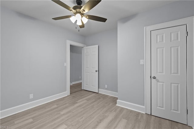 unfurnished bedroom with ceiling fan and light hardwood / wood-style floors