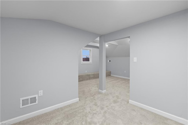 bonus room featuring light carpet and lofted ceiling