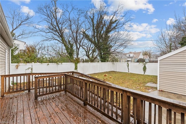 wooden deck with a lawn