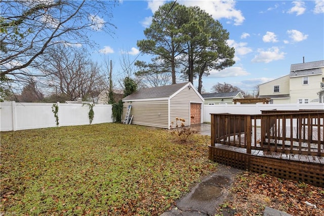 view of yard featuring an outbuilding and a deck