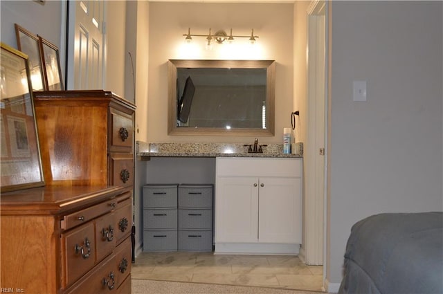 bathroom featuring tile patterned flooring and vanity