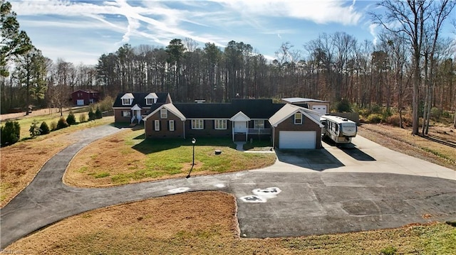 view of front of property featuring a garage and a front yard