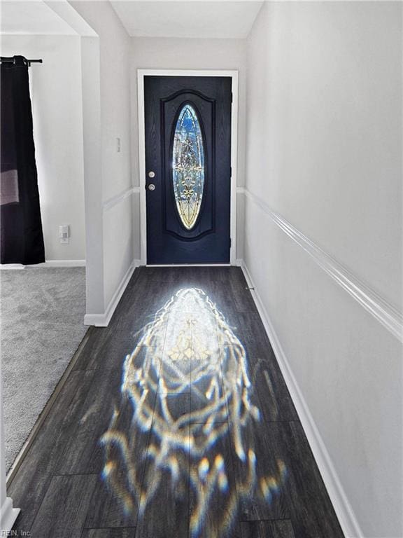 foyer entrance with dark hardwood / wood-style floors