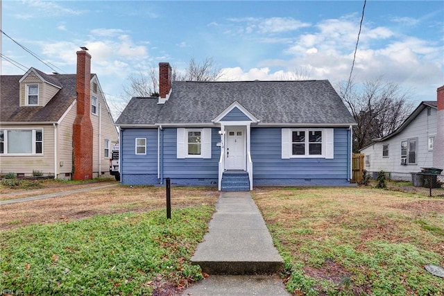 bungalow-style house with a front yard