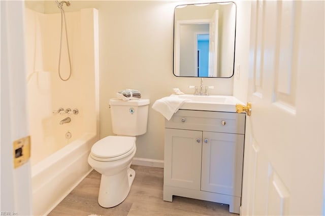 full bathroom with vanity, wood-type flooring, bathtub / shower combination, and toilet