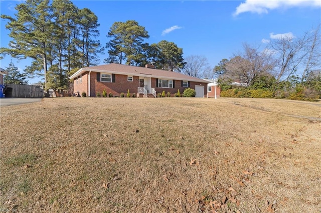 ranch-style house featuring a front lawn