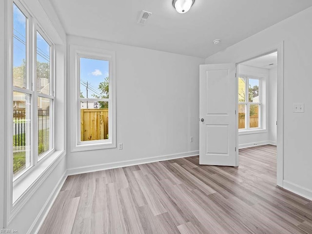 unfurnished room featuring light wood-type flooring