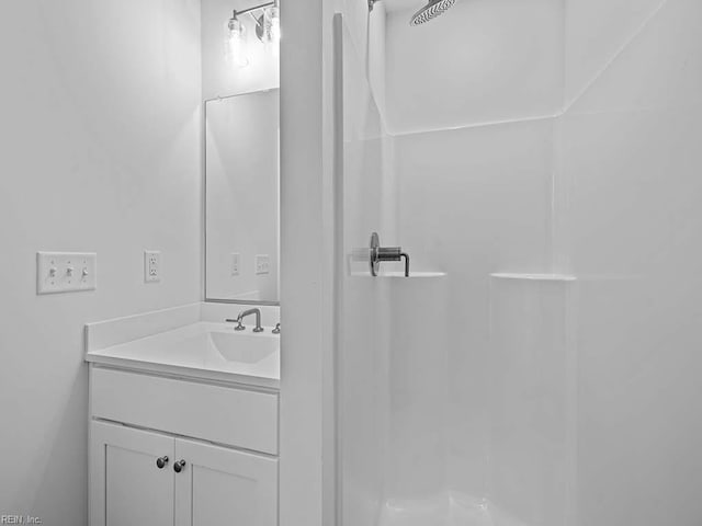 bathroom with vanity and walk in shower