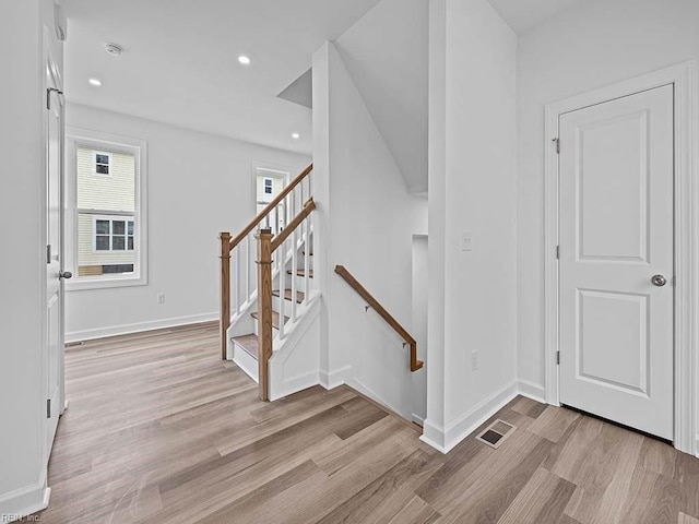 foyer with light hardwood / wood-style floors