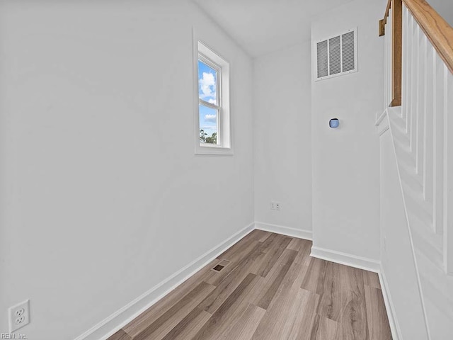 laundry area featuring light hardwood / wood-style flooring