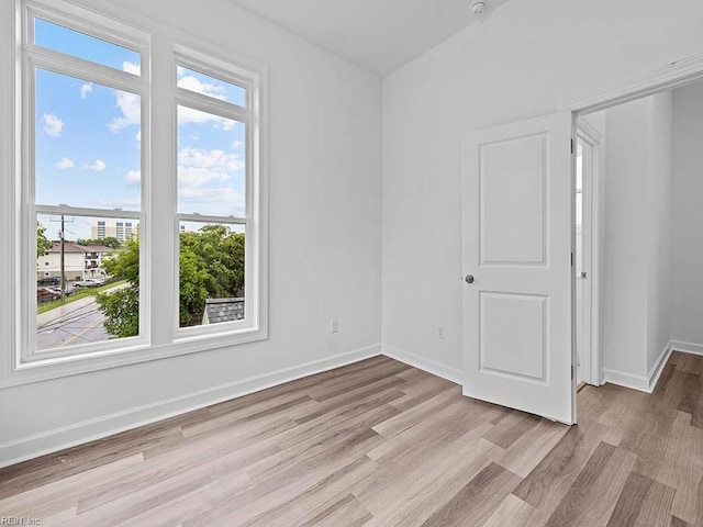 spare room featuring light hardwood / wood-style floors