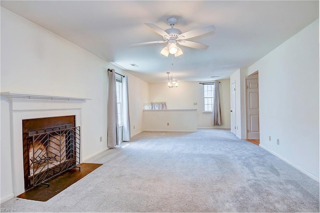 living room with ceiling fan and carpet