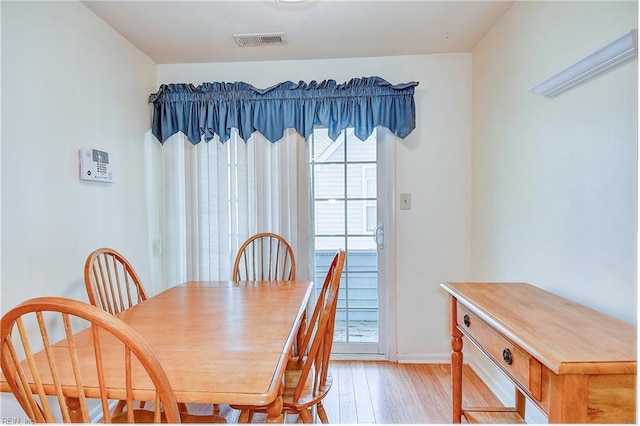 dining space featuring light hardwood / wood-style floors