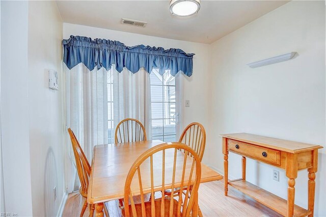 dining room featuring light hardwood / wood-style flooring