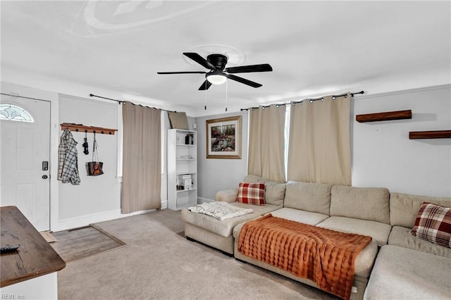 carpeted living room with ceiling fan