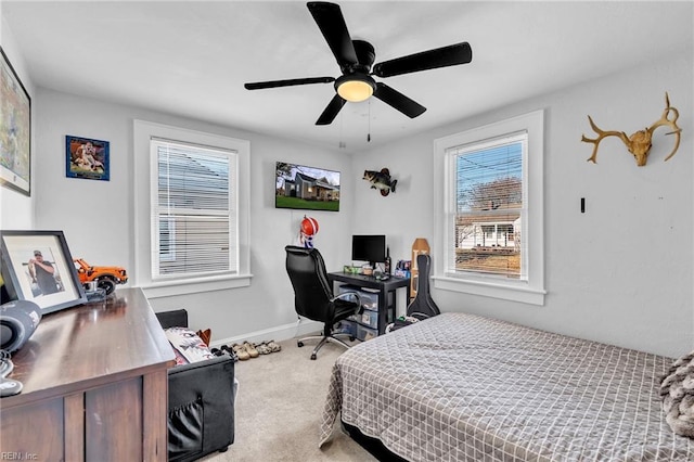 carpeted bedroom with ceiling fan