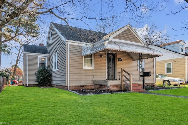 bungalow-style house featuring a front lawn