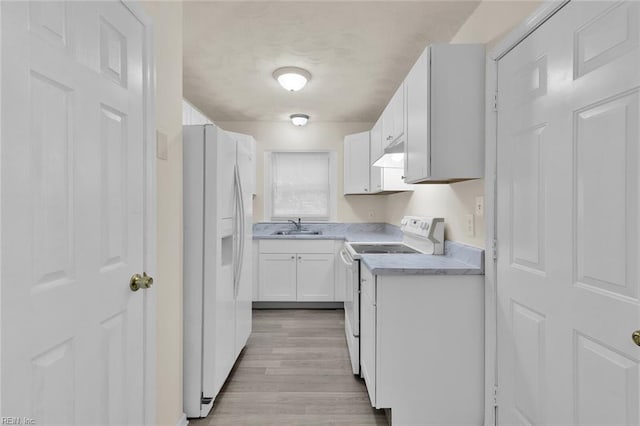 kitchen with light wood-type flooring, sink, range, white cabinetry, and white fridge with ice dispenser