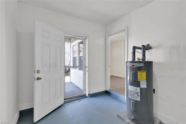 entrance foyer with electric water heater and concrete floors