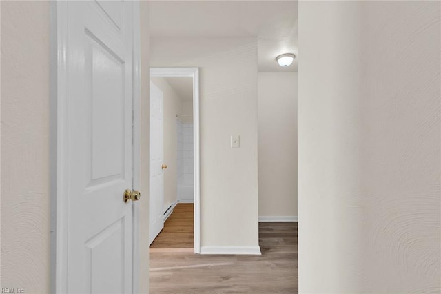 corridor featuring light hardwood / wood-style floors