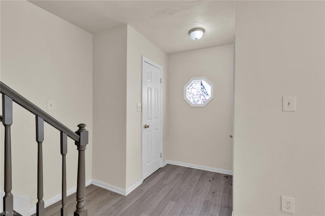 foyer entrance with light wood-type flooring