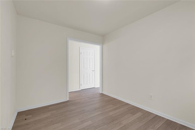 spare room featuring light hardwood / wood-style flooring