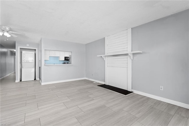 unfurnished living room with ceiling fan