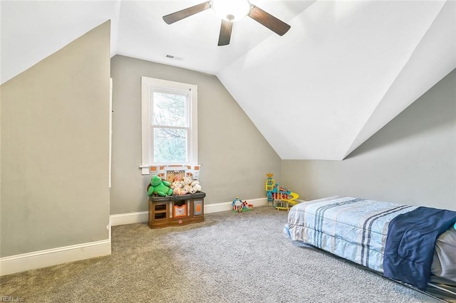 bedroom with carpet flooring, ceiling fan, and vaulted ceiling