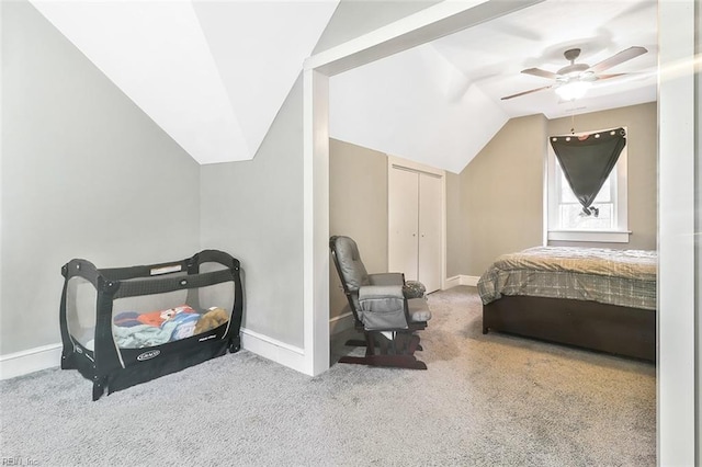 bedroom with carpet, ceiling fan, lofted ceiling, and a closet