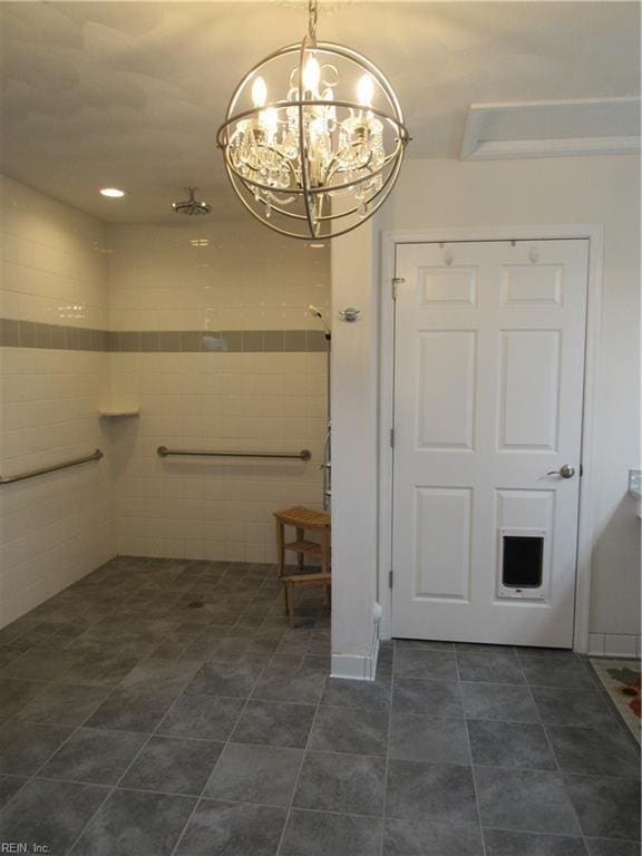 bathroom with a notable chandelier and walk in shower