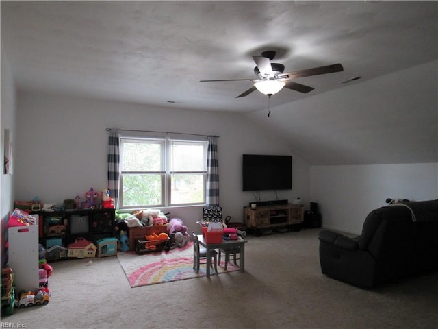 playroom featuring carpet flooring, vaulted ceiling, and ceiling fan