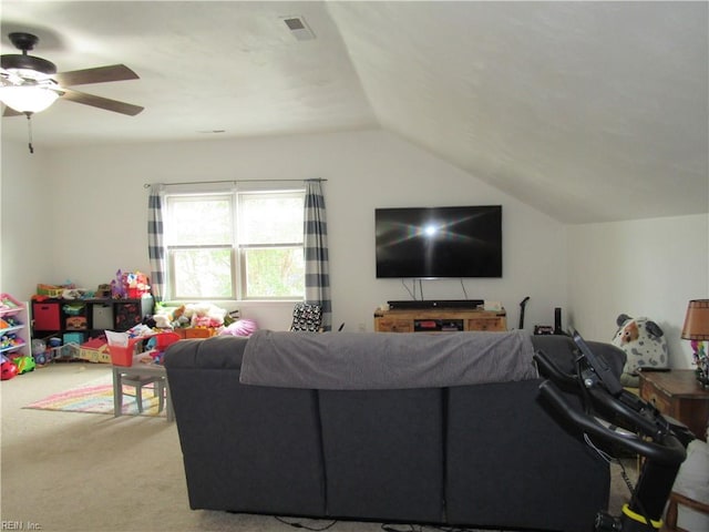 carpeted living room featuring ceiling fan and lofted ceiling