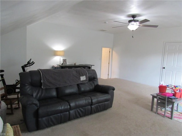 carpeted living room with ceiling fan