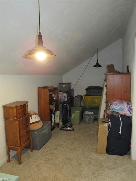 bonus room with lofted ceiling and light carpet