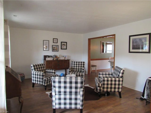 living room with dark hardwood / wood-style flooring