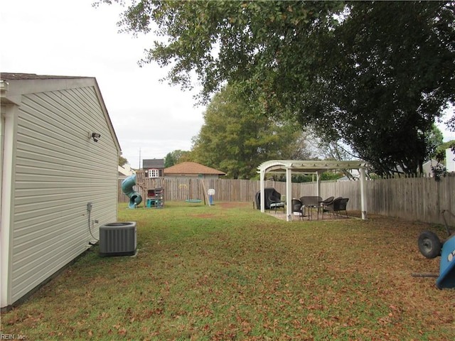 view of yard with a pergola, a playground, and central AC unit