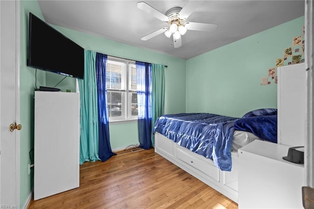 bedroom featuring ceiling fan and hardwood / wood-style floors