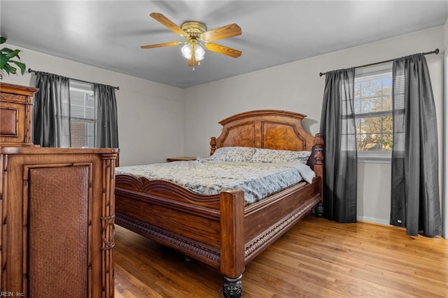 bedroom featuring light wood-type flooring and ceiling fan