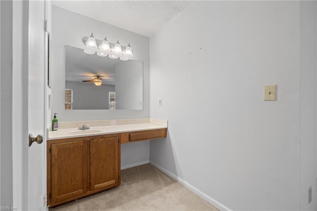 bathroom with vanity, a textured ceiling, and ceiling fan