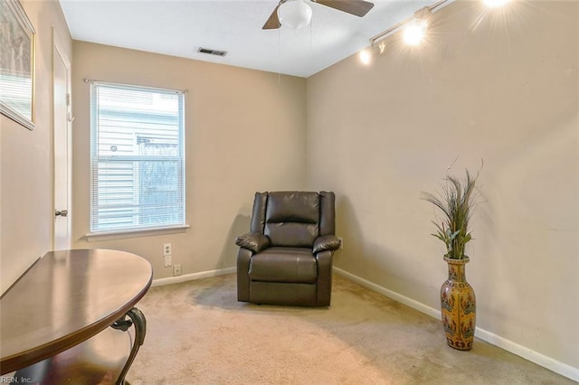 sitting room featuring carpet flooring, ceiling fan, and rail lighting