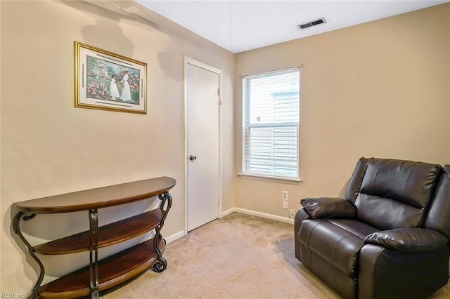 sitting room with light carpet