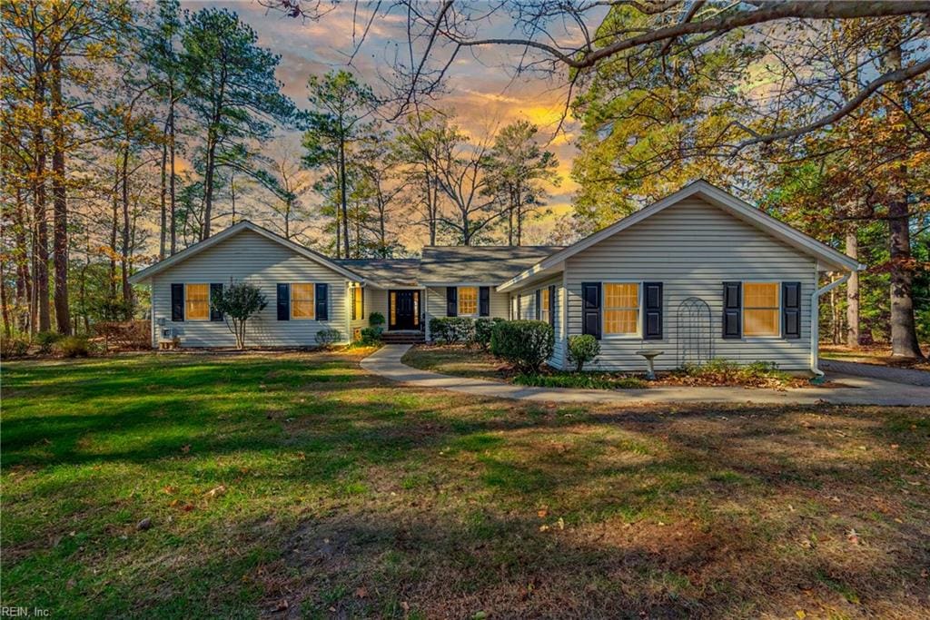 ranch-style house with a lawn