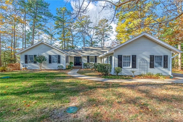 single story home with a front lawn