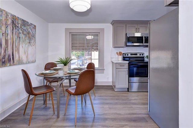 dining room with light wood-type flooring